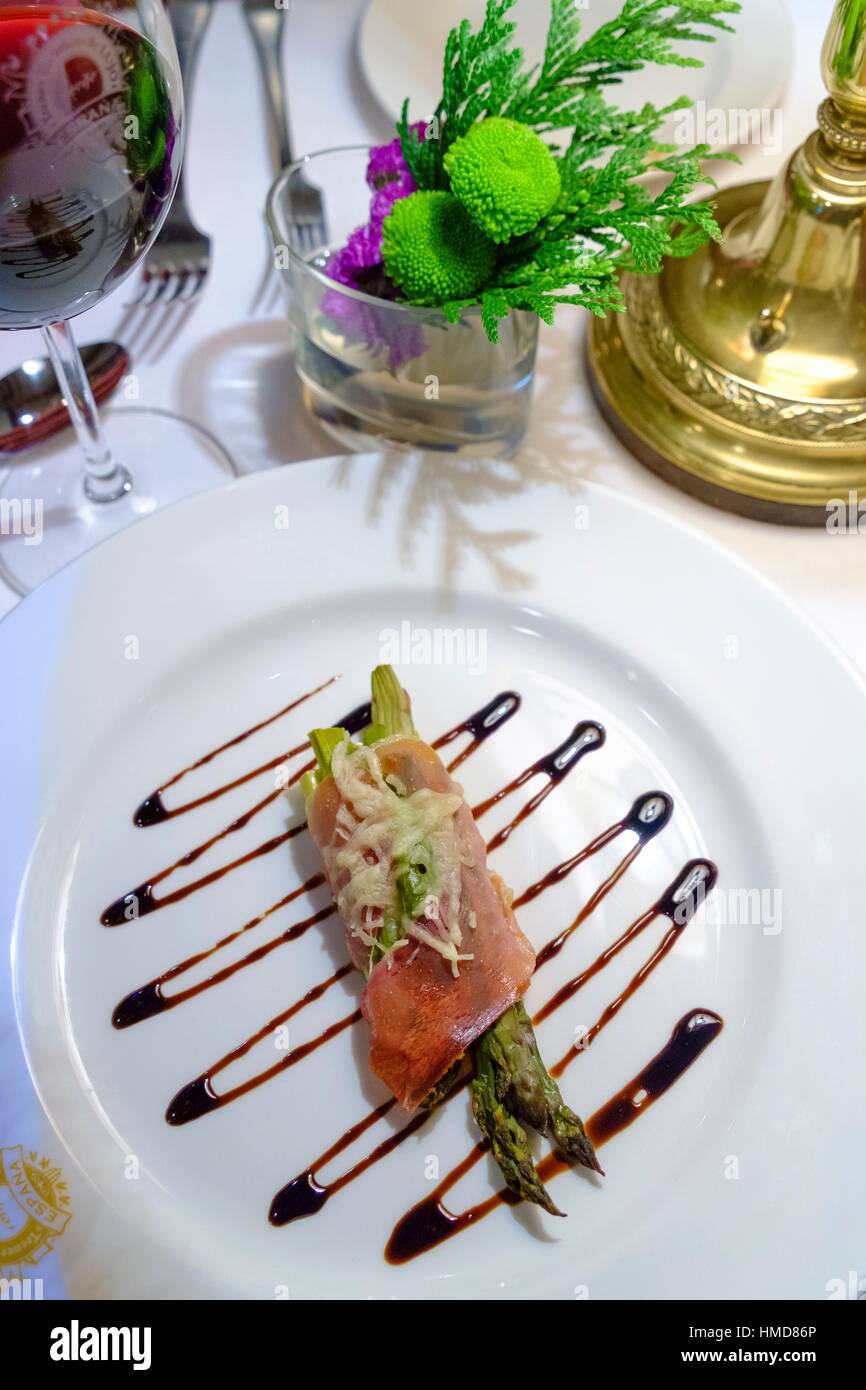 Dish with ham and vegetables in the restaurant of AlAndalus, luxury train in Andalusia, Spain