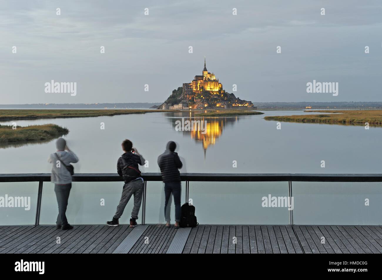 Mont-Saint-Michel in the mouth of the Couesnon river seen from the footbridge on the dam, Manche department, Normandy region, France, Europe. Stock Photo