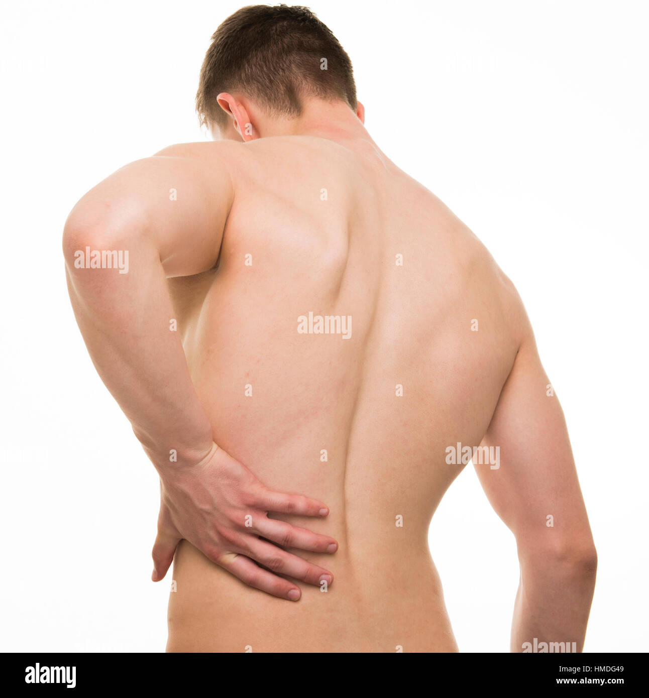 Young man with back pain - Studio shot isolated on white Stock Photo