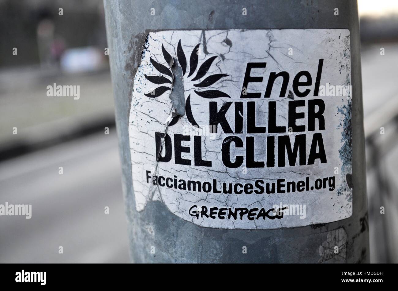 Vicenza, Italy: a Greenpeace sticker against ENEL, Italian national electricity company, considered as a ´climate killer´ Stock Photo
