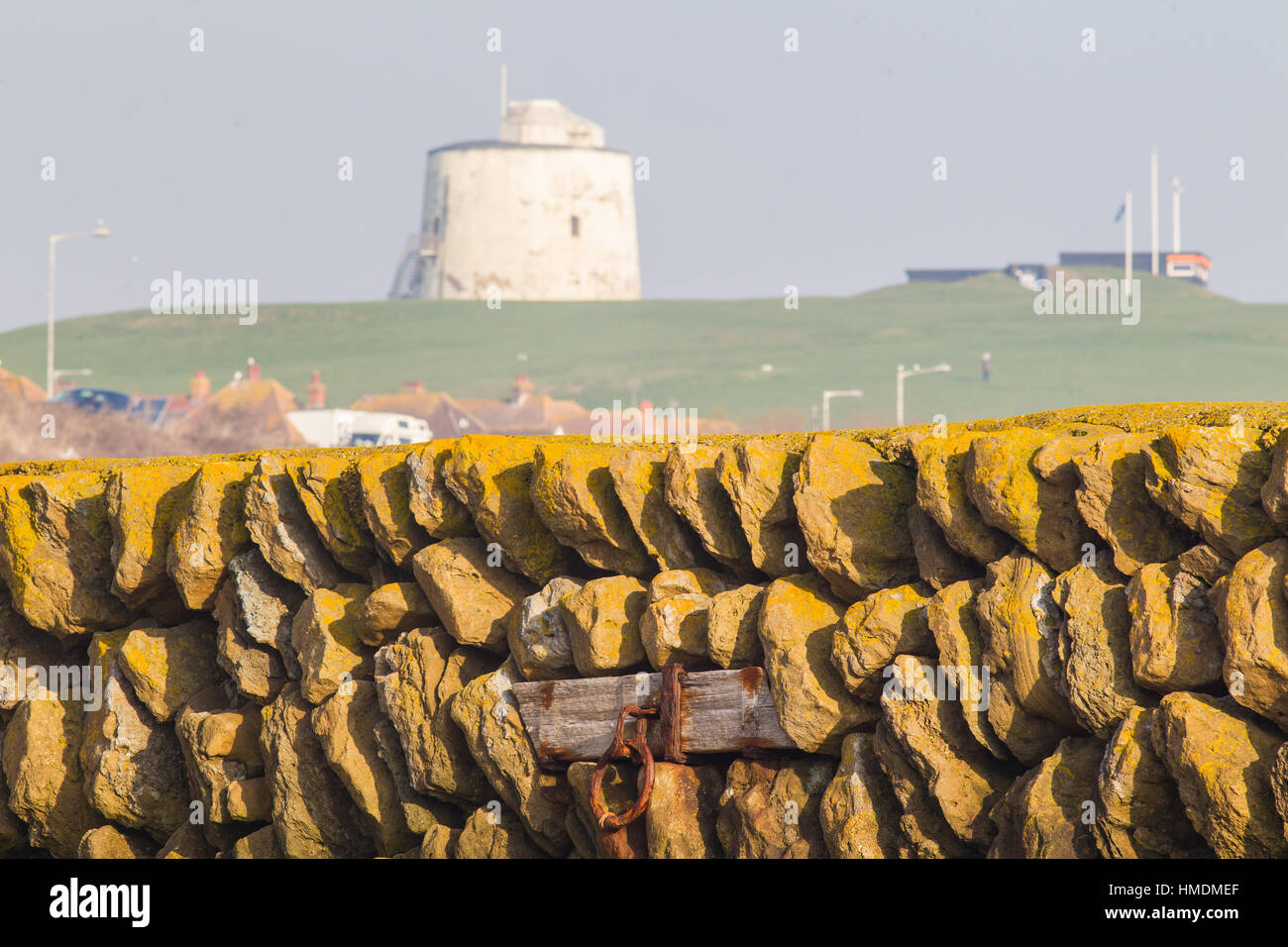 The East Head Folkestone harbour break water with Martello Tower No3 and the Folkestone Coast guard station in the back ground. Stock Photo