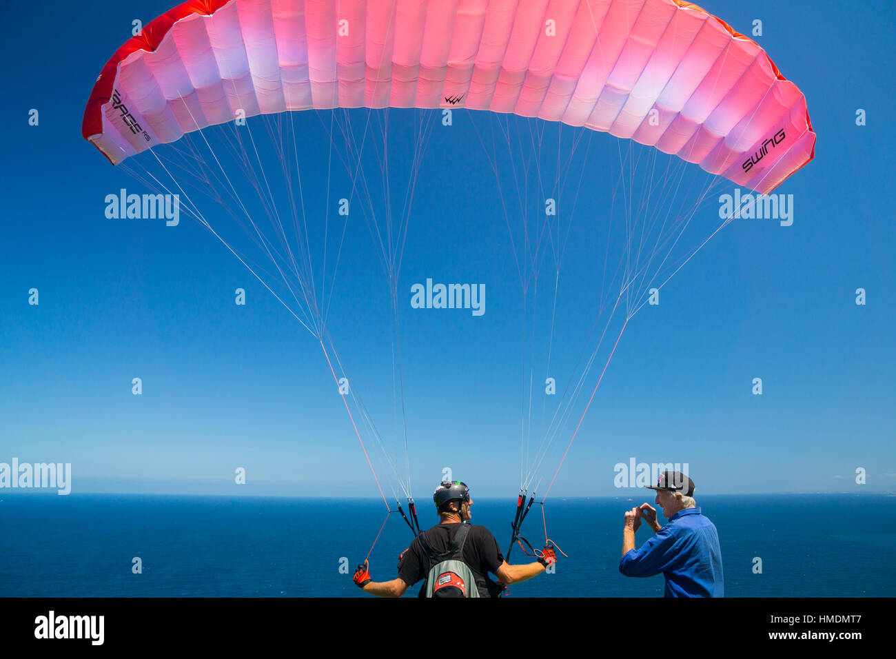 A paraglider prepares for takeoff Stock Photo Alamy