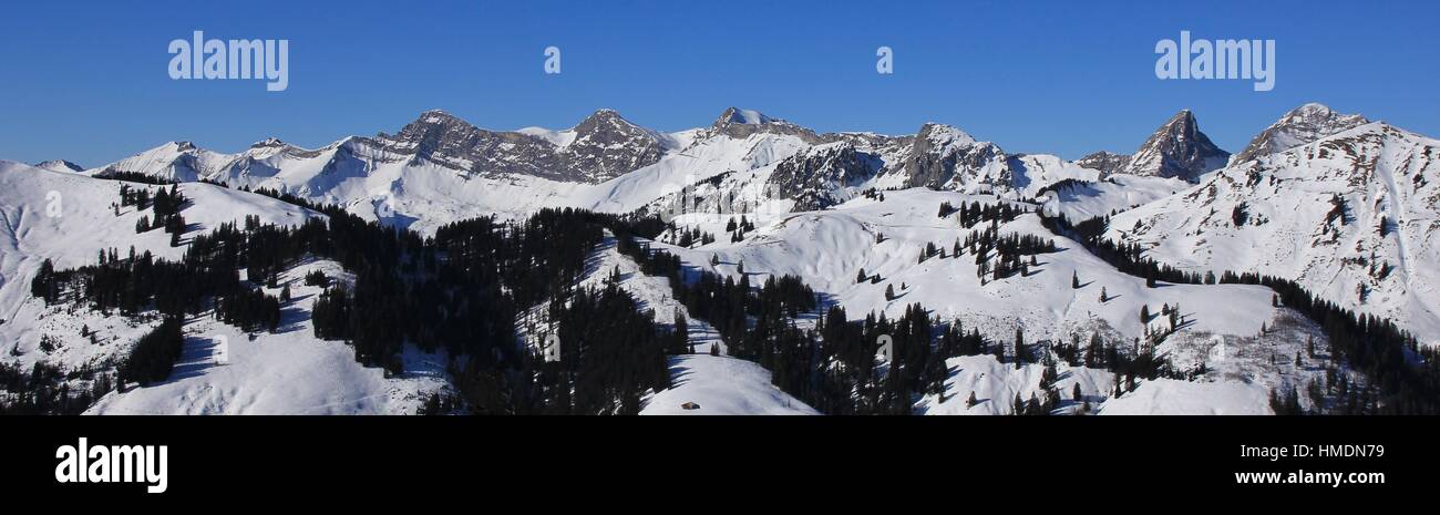 View from the Rellerli ski area, Switzerland. Vanil Noir and other snow covered mountains. Stock Photo