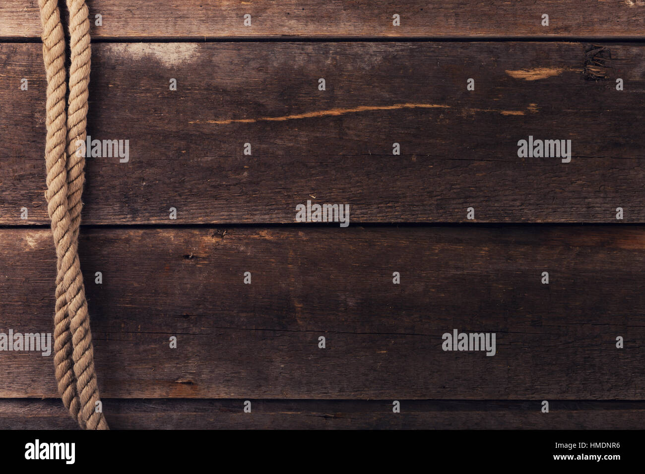 vintage background with old rope on wood planks Stock Photo