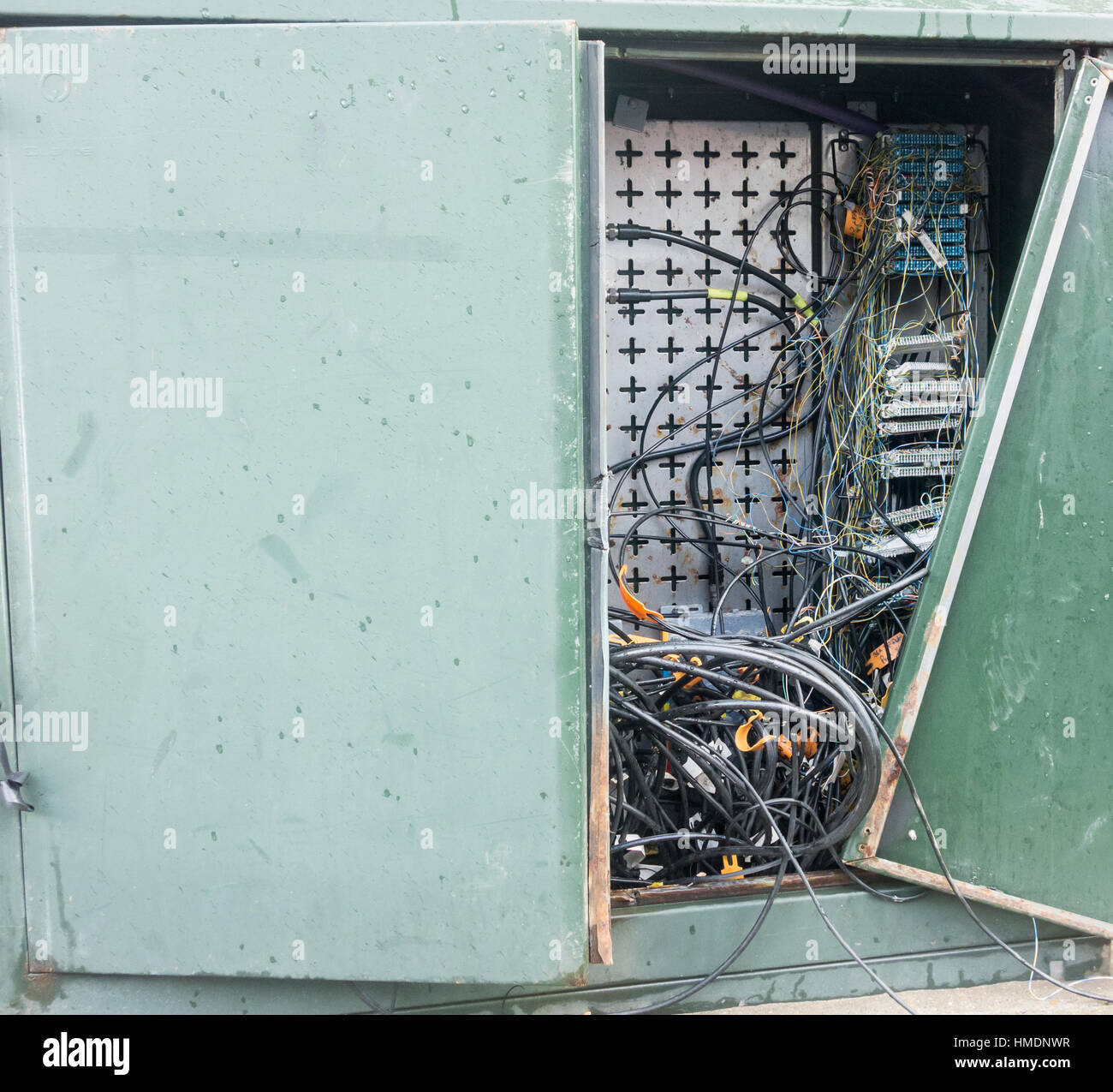 Vandalized BT junction box in street. UK Stock Photo