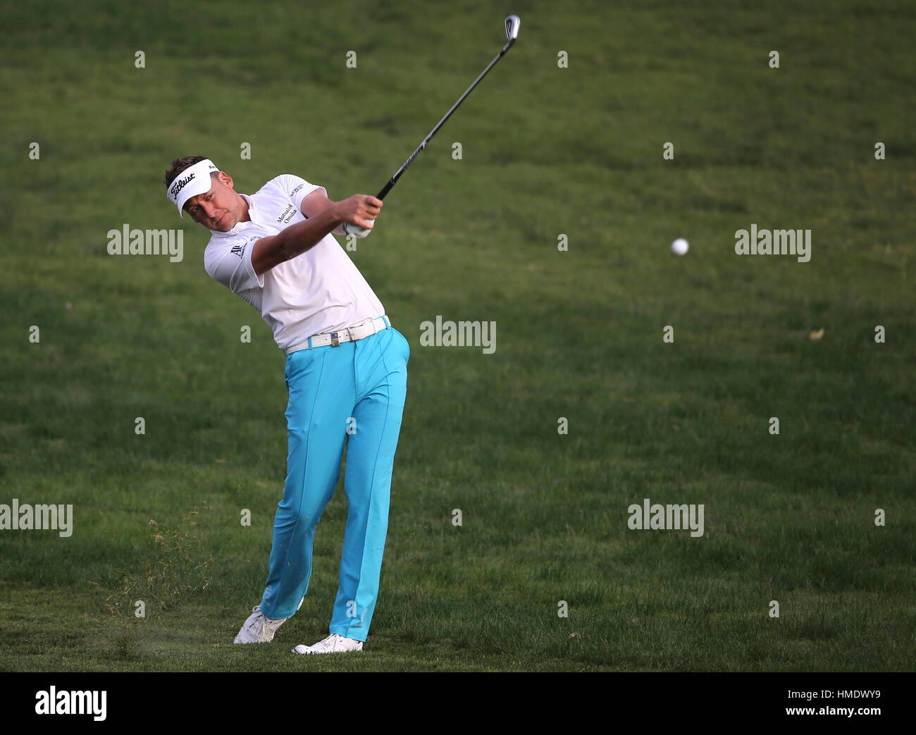 Ian Poulter of England plays a shot on the 10th hole during the first round of the Dubai Desert Classic golf tournament in Dubai, United Arab Emirates, Thursday, Feb. 2, 2017. (AP Photo/Kamran Jebreili) Stock Photo