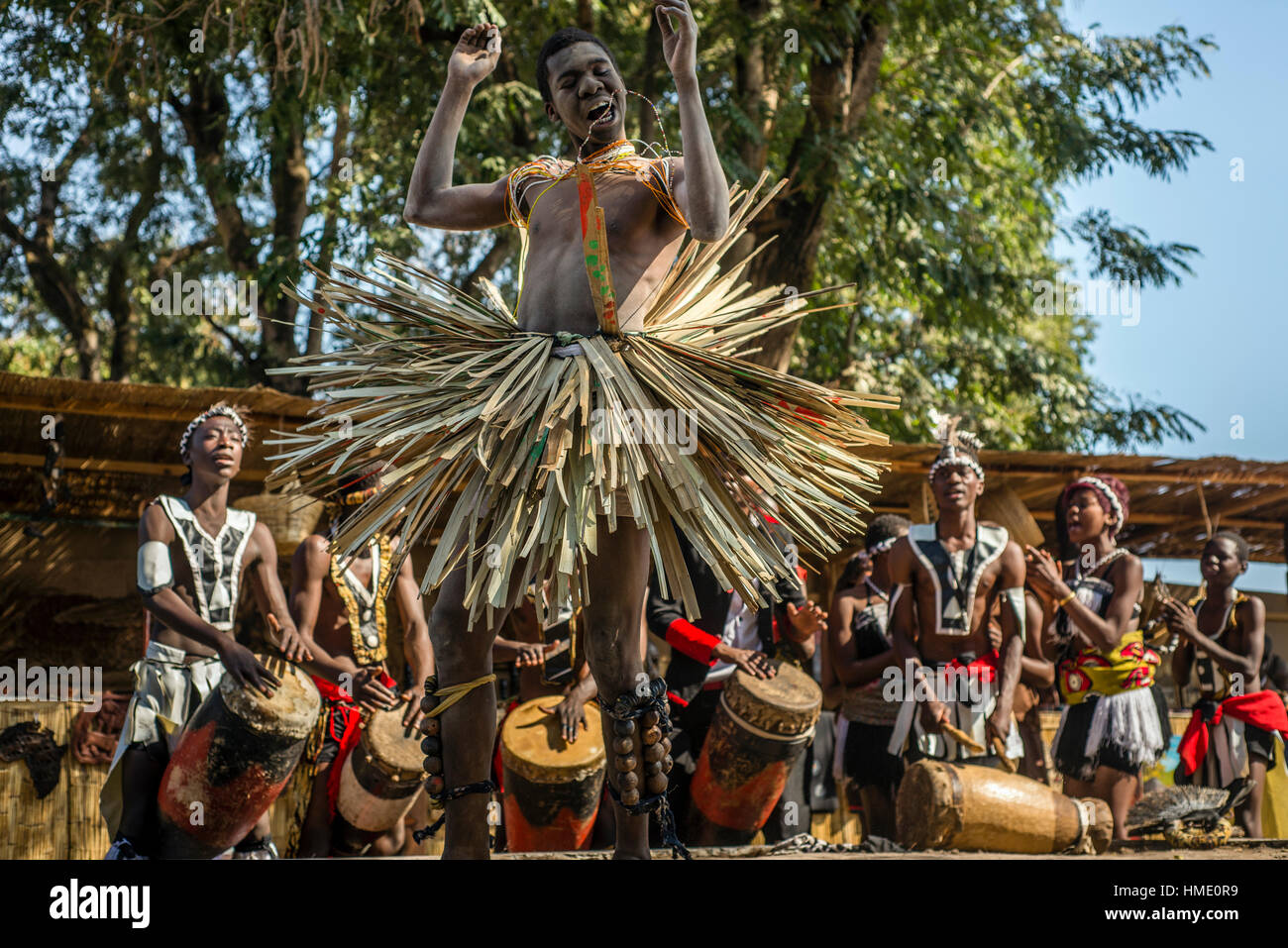 A young man performs traditional dance with fire at Zambia