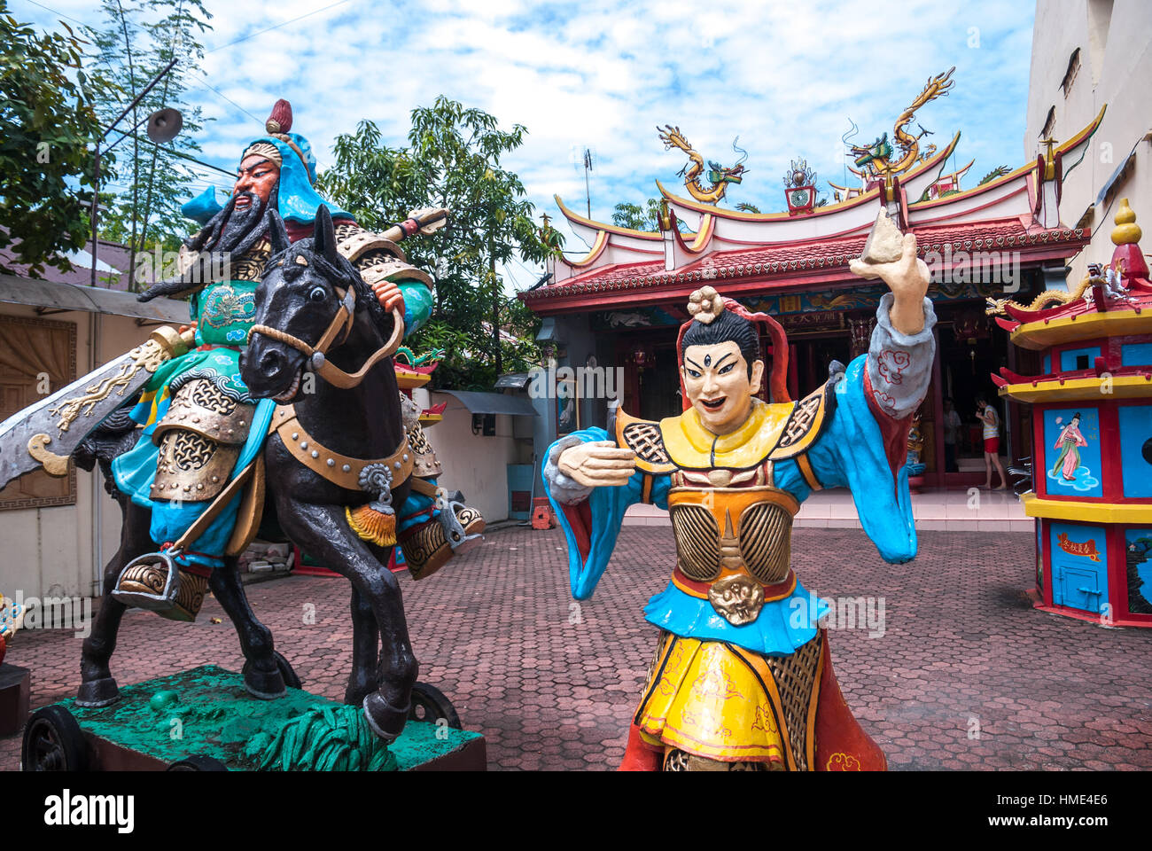 Sculptures of a warrior and Kwan Kong (Guan Yu) god riding a horse, at Kwan Kong temple in Manado, North Sulawesi, Indonesia. Stock Photo