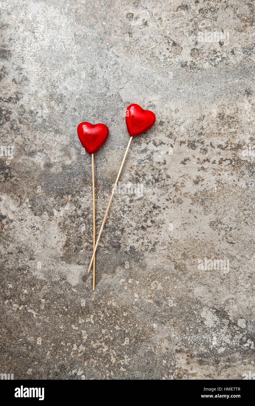 Valentines Day decoration. Red hearts on stone background Stock Photo