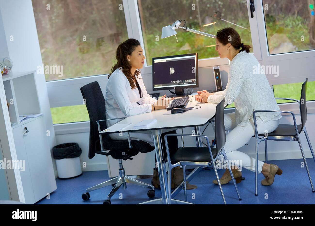 Doctor attending to patient medical consultation. Office. Plastic