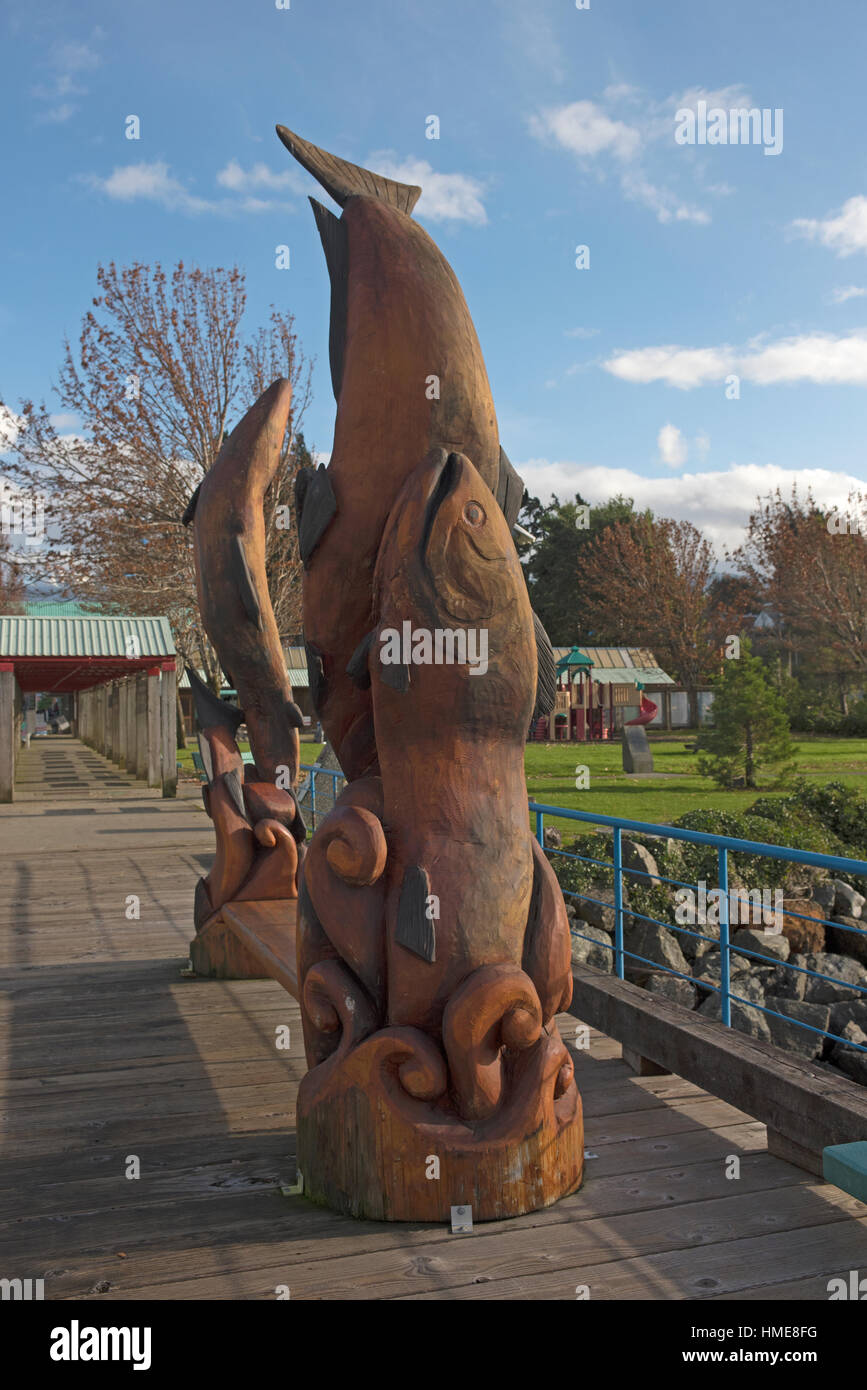 Timber carvings of Salmon on the viewing pier at Port Alberni, Vancouver Island. BC. Canada. SCO 11,760. Stock Photo