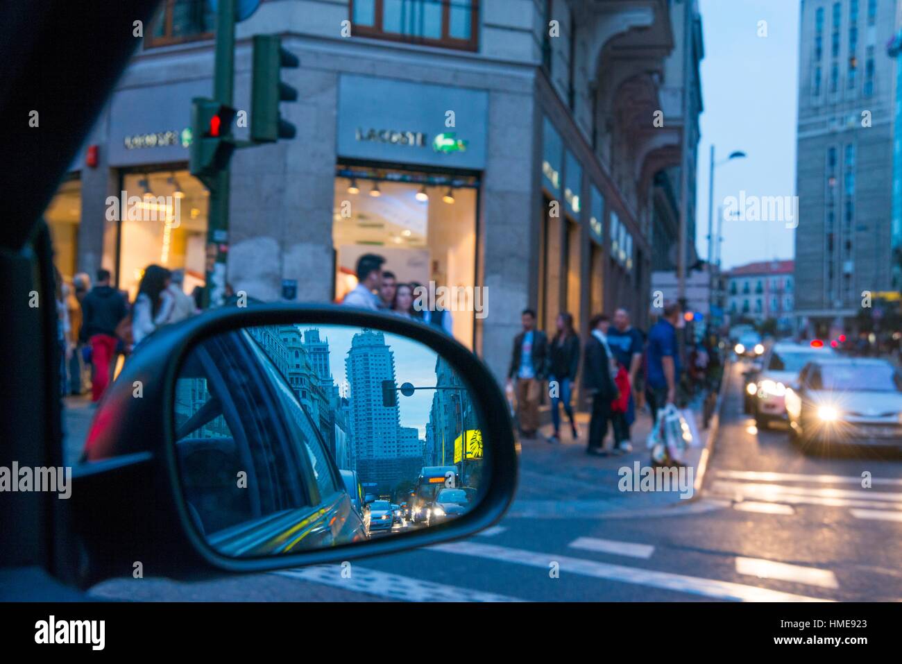 Aspect of the city at night through a car´s rear view mirror. Gran Via street, Madrid, Spain. Stock Photo