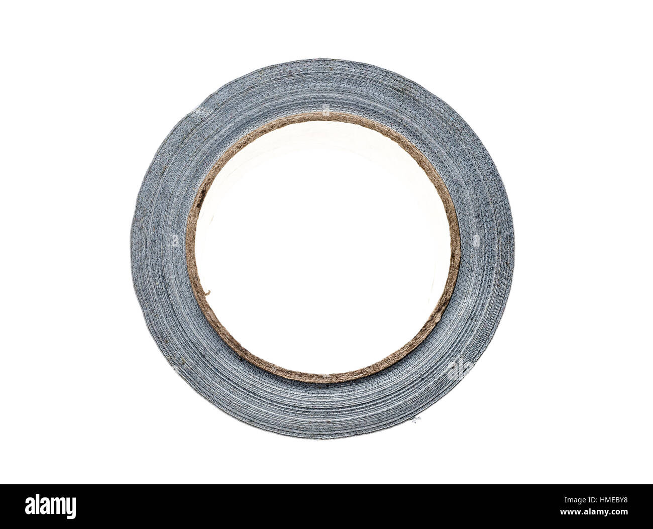 Silver duct gaffer repair tape roll isolated on white. Close up of sticky reel of adhesive repair tape on white background. Stock Photo