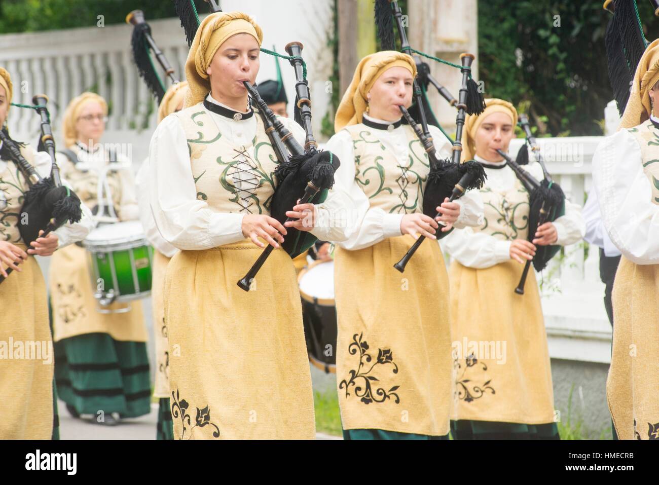 Bagpipes band parade through the streets of Muros del Nalon, Asturias