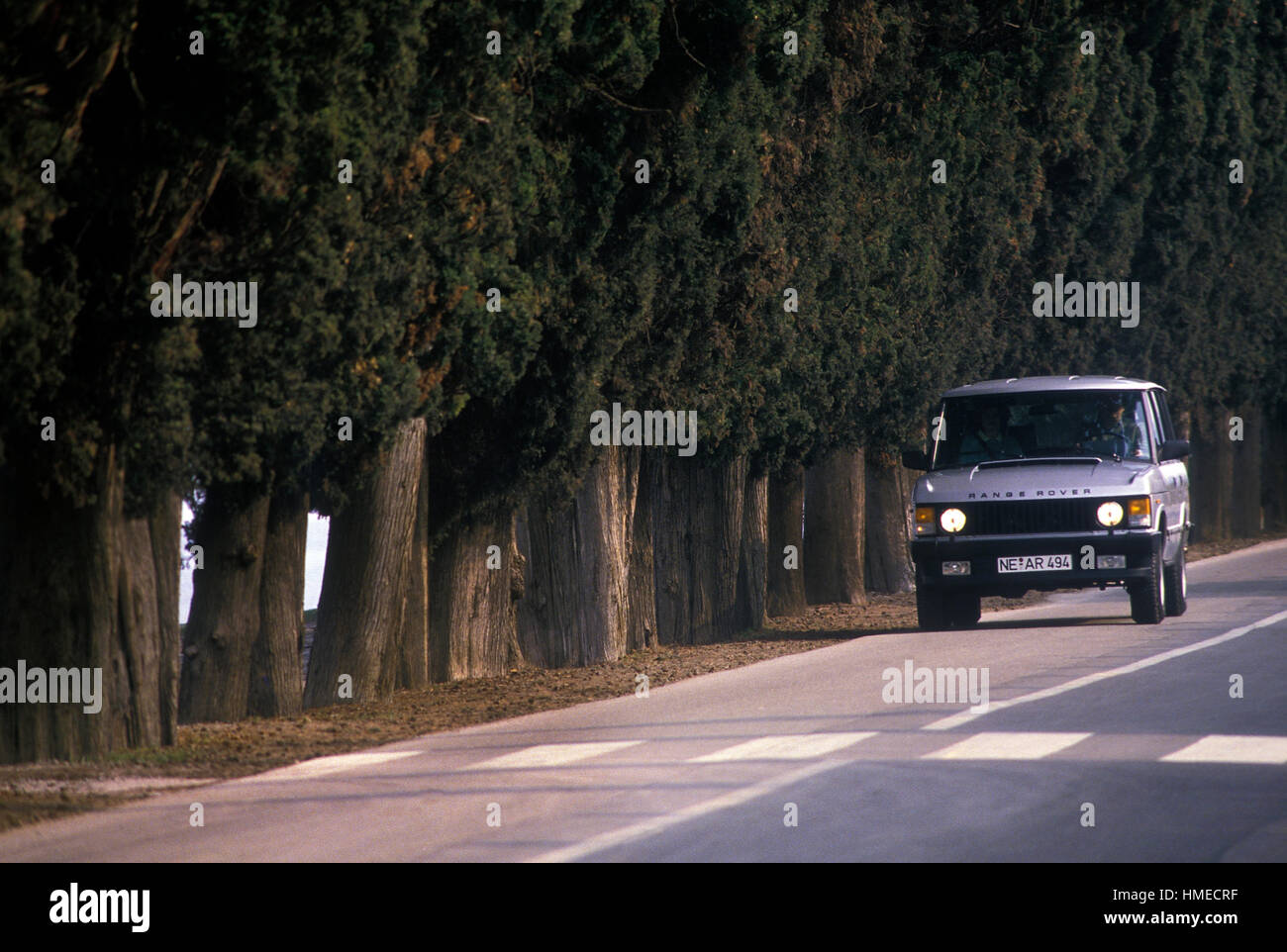 1982 Range Rover Classic driving on a road in Italy Stock Photo