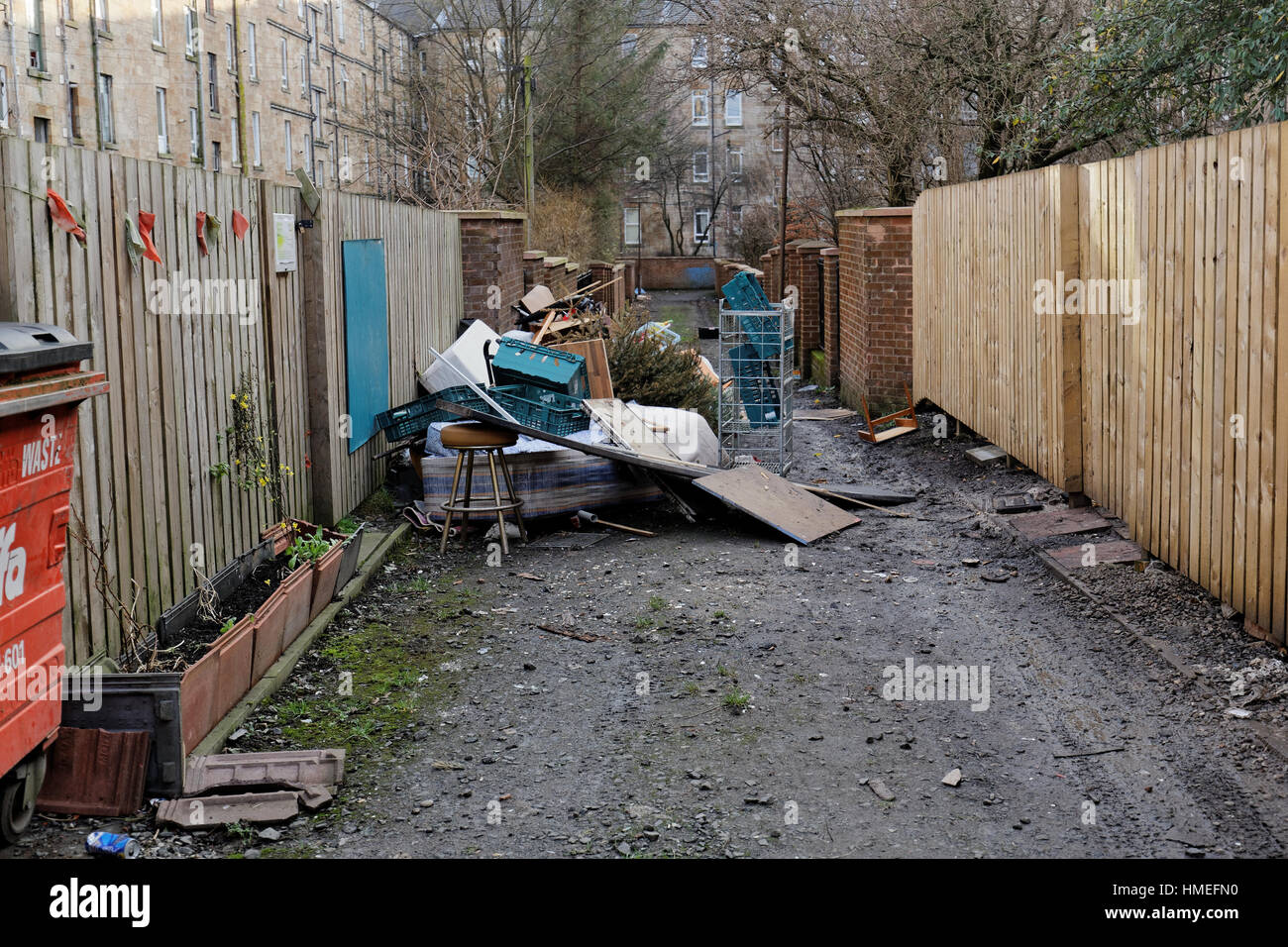 fly tipping, rubbish, litter in back court Govanhill, Glasgow Stock Photo