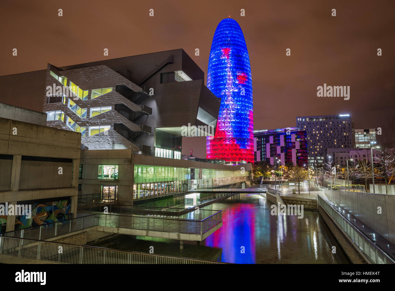 Night scene with Torre Agbar. Museu del Disseny de Barcelona, Barcelona, Spain. Architect: MBM Arquitectes Stock Photo