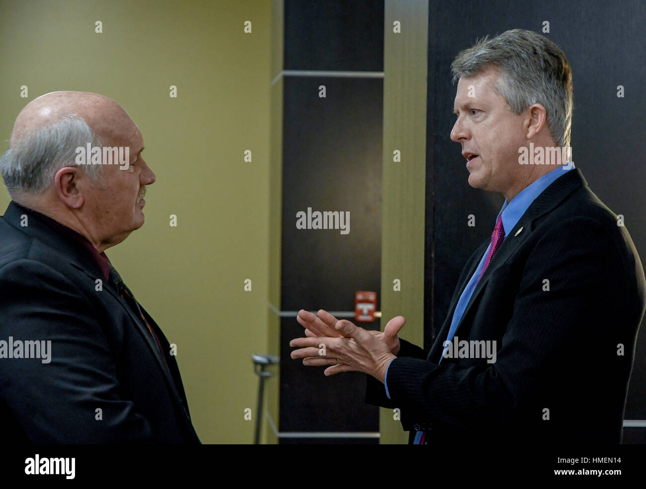 Freshman congressman Dr. Roger Marshall attends the 120th annual Chamber of Commerce dinner at Webb Hall in the Memorial Union of Emporia State University. Chats with Ed Rathe the former manager of Emporia's  William Lindsey White Civil Auditorium Stock Photo