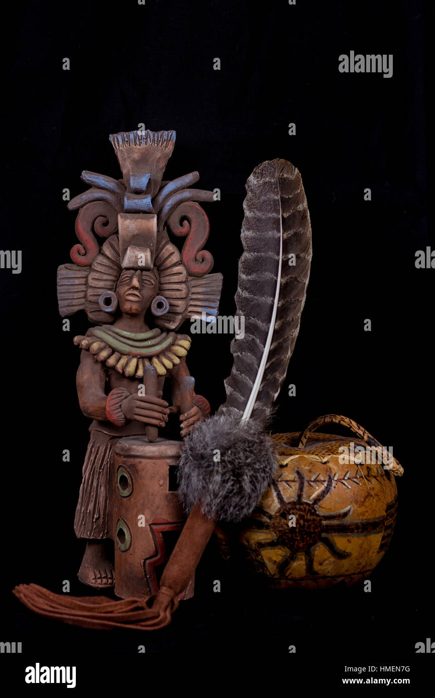 mayan native american statue with bowl and feather Stock Photo