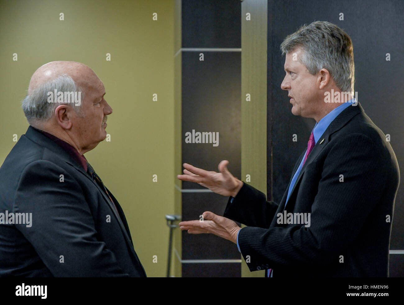 Freshman congressman Dr. Roger Marshall attends the 120th annual Chamber of Commerce dinner at Webb Hall in the Memorial Union of Emporia State University. Chats with Ed Rathe the former manager of Emporia's  William Lindsey White Civil Auditorium Stock Photo