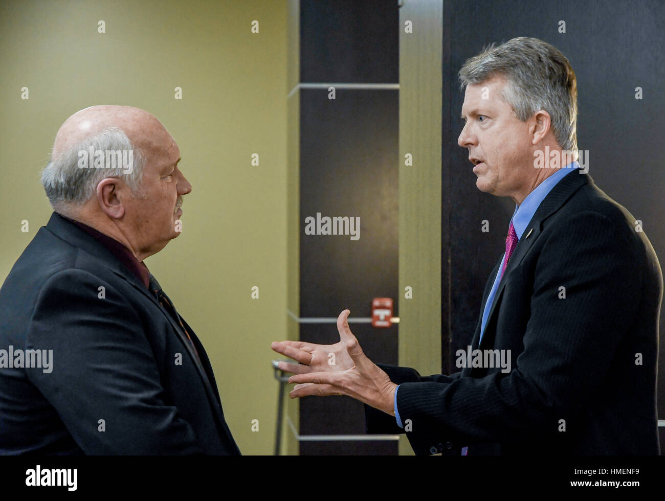 Freshman congressman Dr. Roger Marshall attends the 120th annual Chamber of Commerce dinner at Webb Hall in the Memorial Union of Emporia State University. Chats with Ed Rathe the former manager of Emporia's  William Lindsey White Civil Auditorium Stock Photo