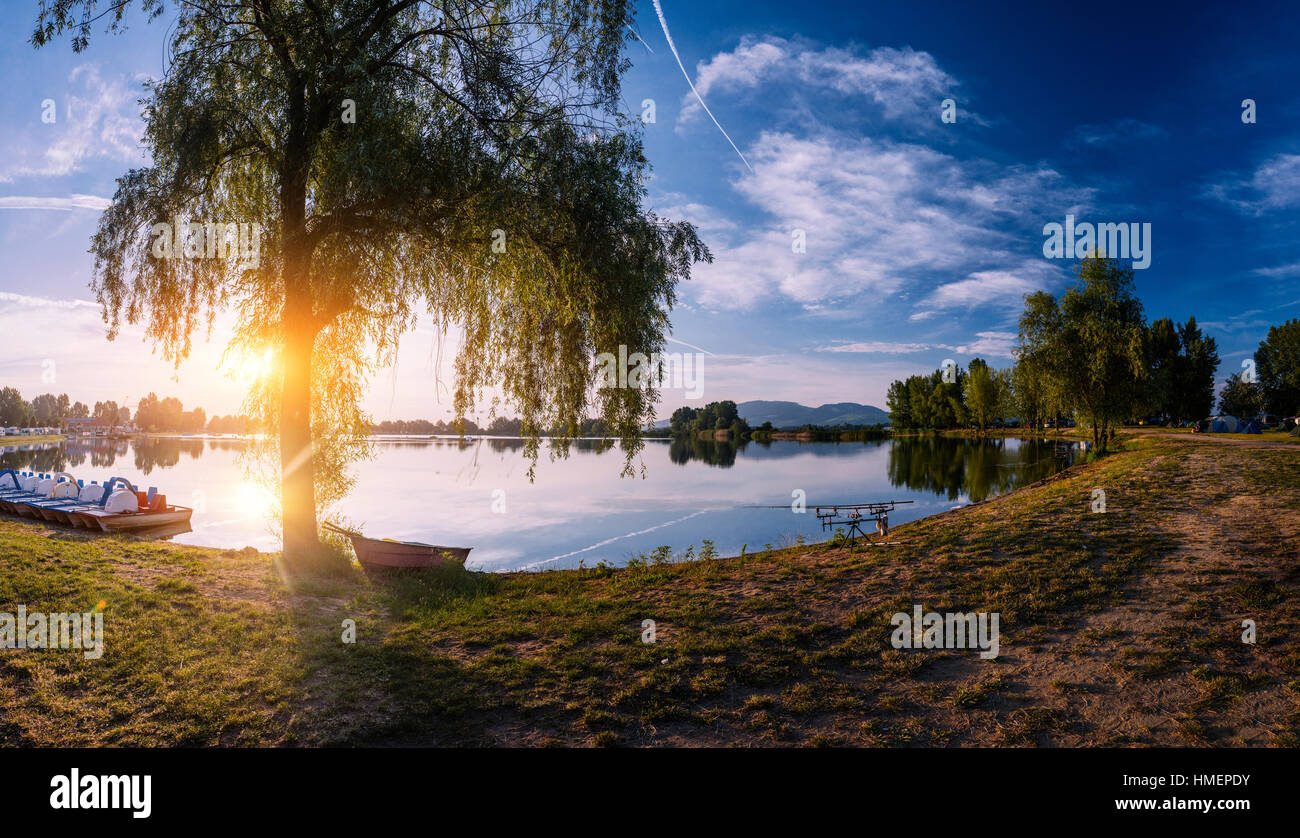 boat at the lake sunset Stock Photo - Alamy
