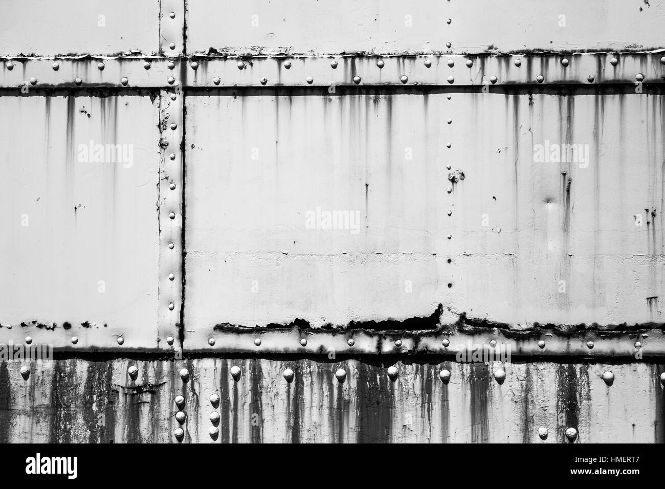 White industrial metal texture with rust and rivets Stock Photo