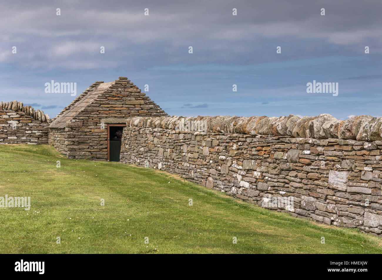 Stone wall and house at Skara Brae, Orkney, Scotland. Stock Photo