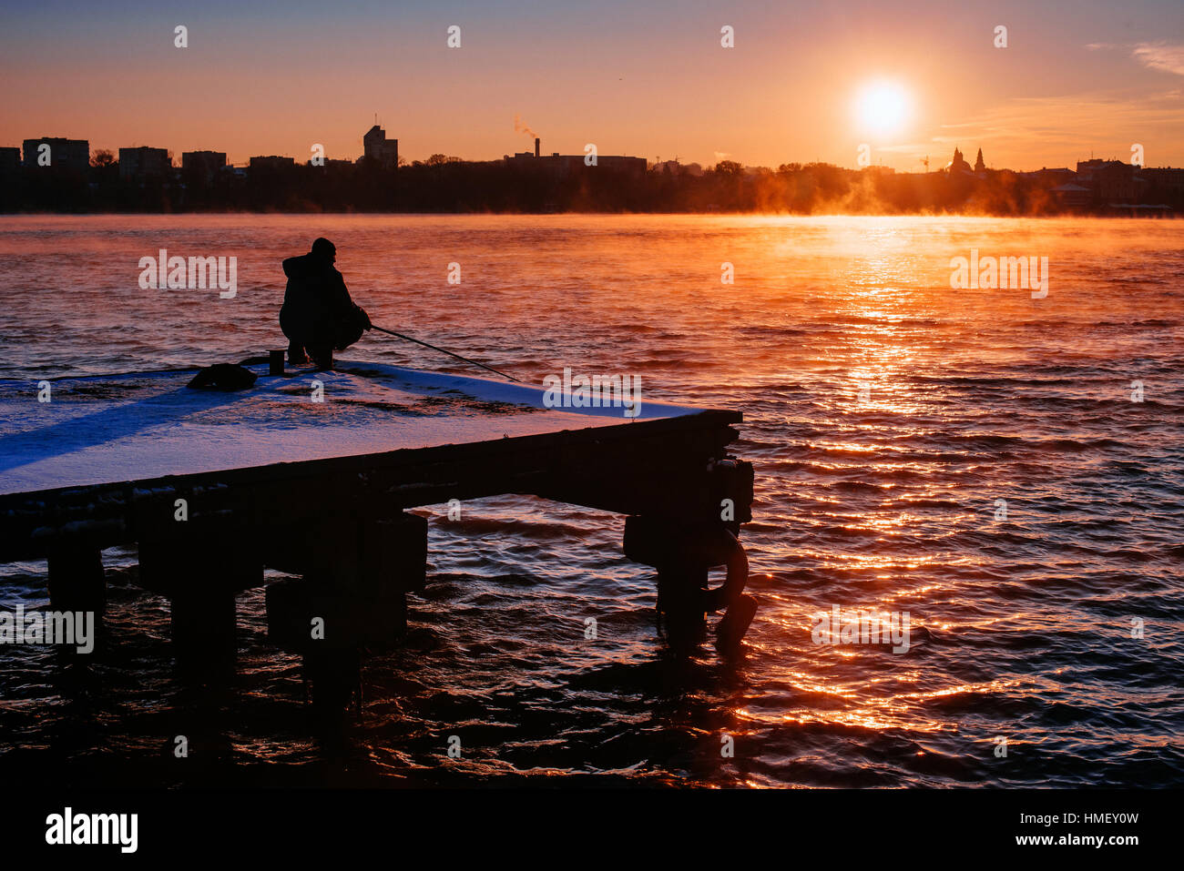 Silhouette of fishermen Stock Photo - Alamy