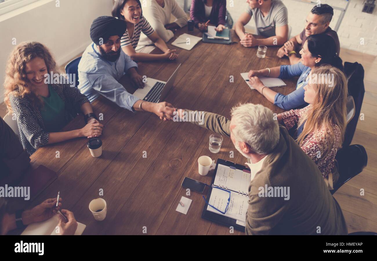 Diverse people teamwork on meeting table Stock Photo