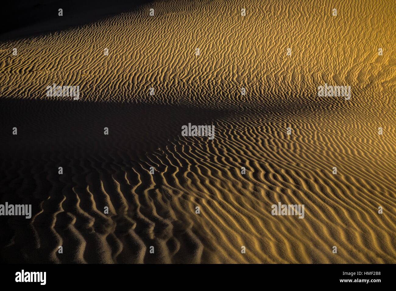 Patterns and ripples produced by erosion are the dominant features of Eureka Dunes at Death Valley National Park, California. Stock Photo
