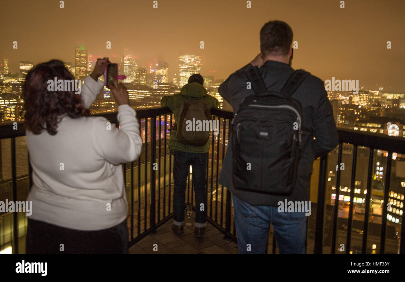 Photographers take photos from the balcony of the Tate Modern Switch House in London Stock Photo