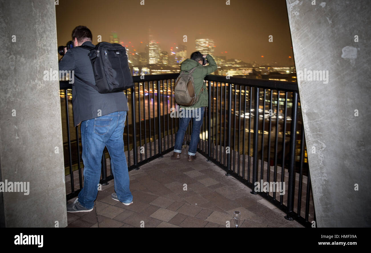 Photographers take photos from the balcony of the Tate Modern Switch House in London Stock Photo