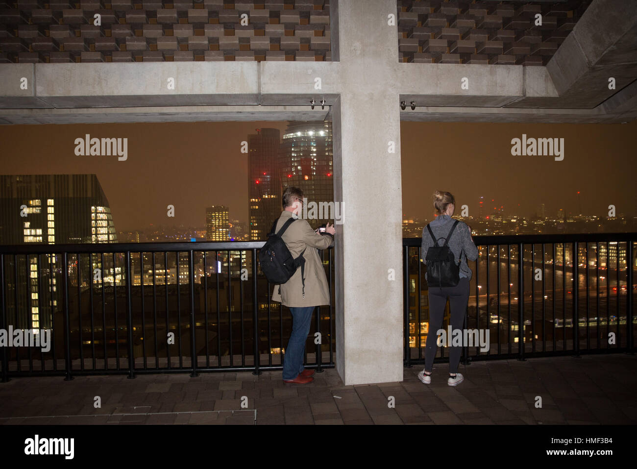 Photographers take photos from the balcony of the Tate Modern Switch House in London Stock Photo