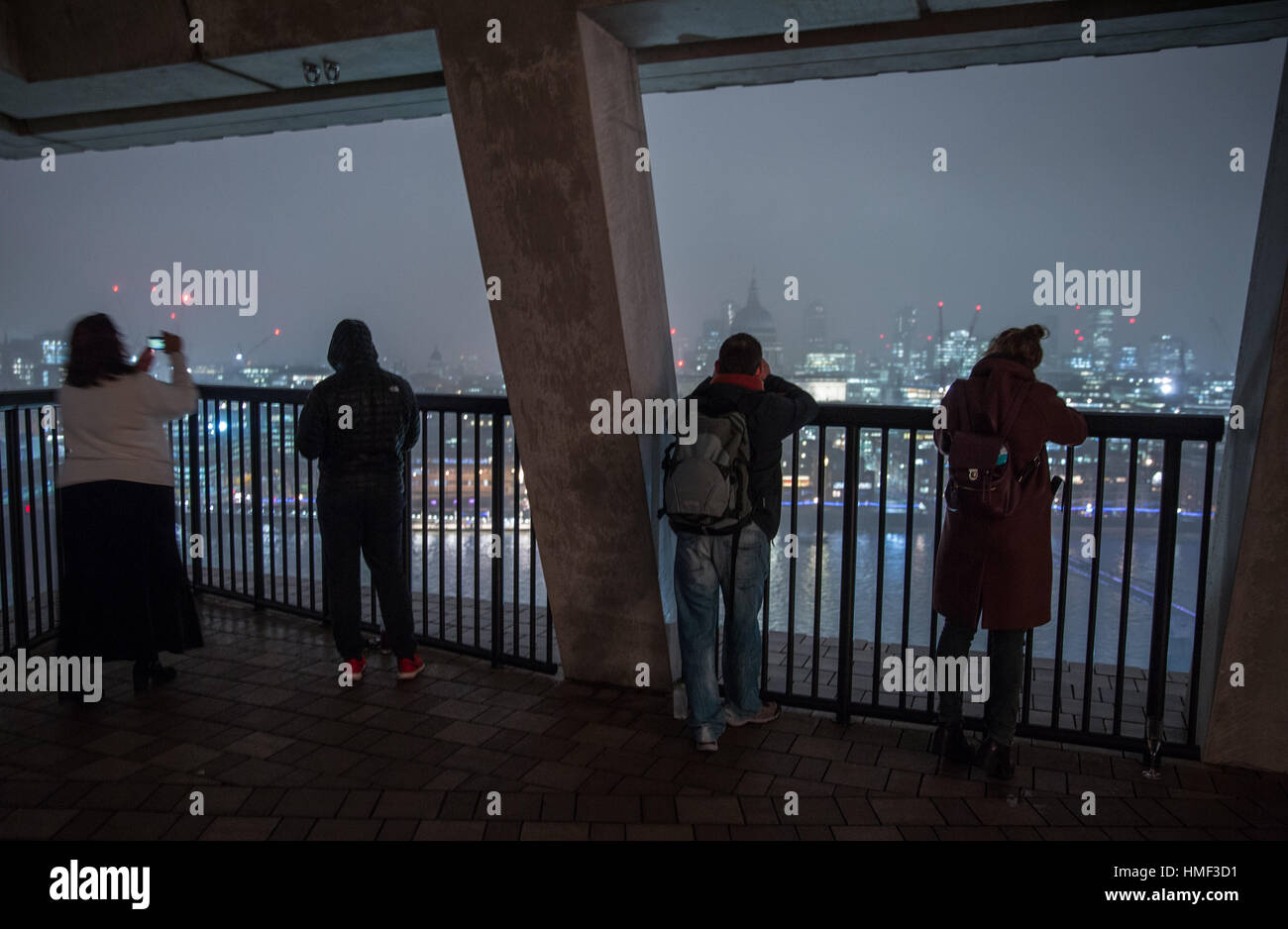 Photographers take photos from the balcony of the Tate Modern Switch House in London Stock Photo