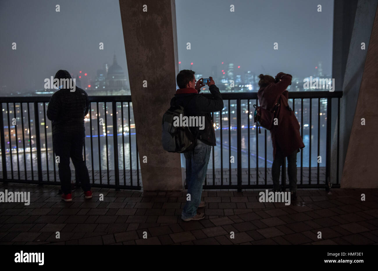 Photographers take photos from the balcony of the Tate Modern Switch House in London Stock Photo