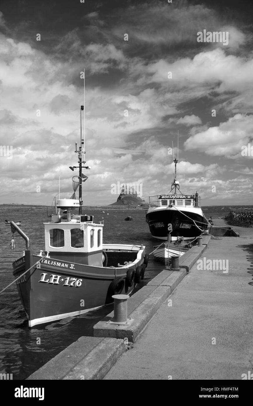 Fishing Boats in the Harbour, with Lindisfarne Castle, Holy Island Lindisfarne, North Northumberland Coast, Area of Outstanding Natural Beauty, Herita Stock Photo