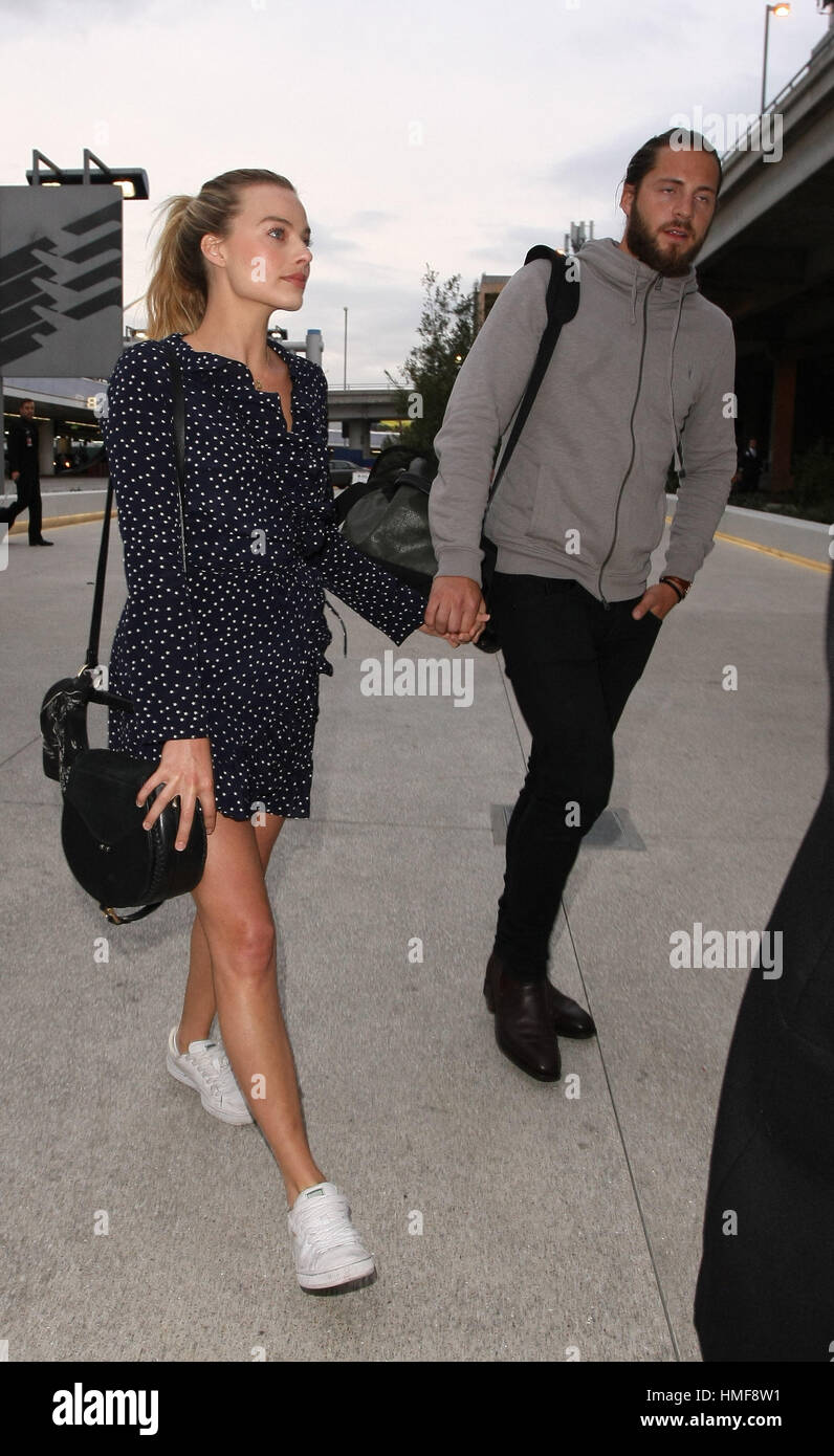 Margot Robbie and her husband Tom Ackerley at Los Angeles International  Airport (LAX) Featuring: Margot Robbie,