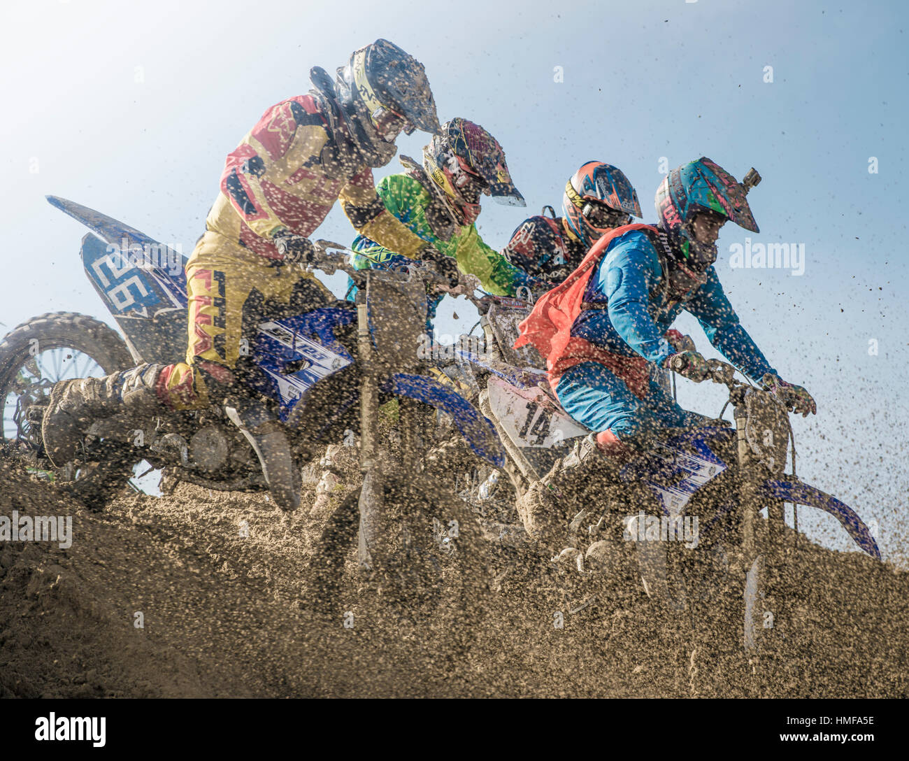 Motorcycle riders competing in a beach race Stock Photo