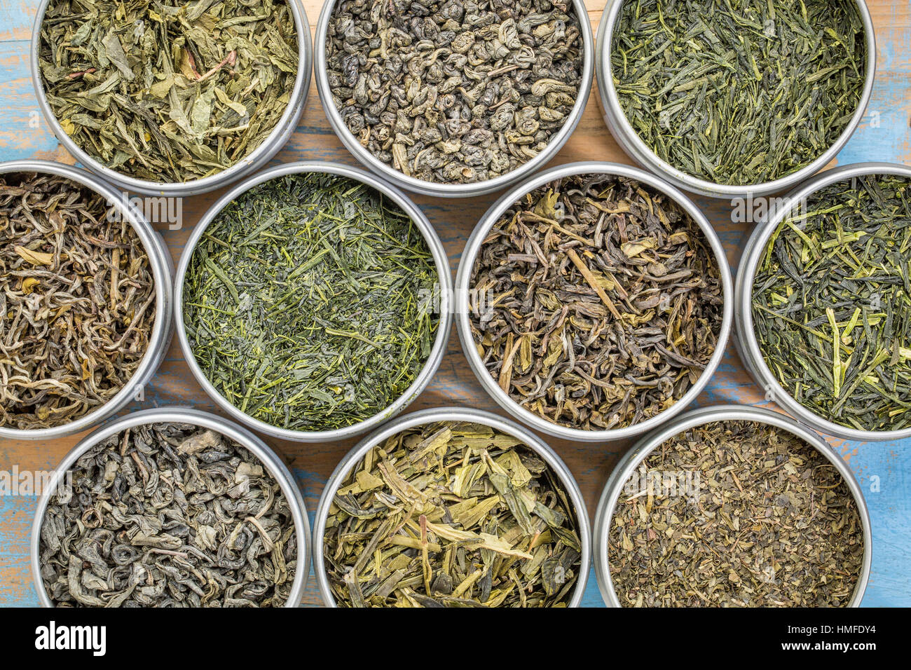green tea sampler top view of loose leaf teas in metal cans against