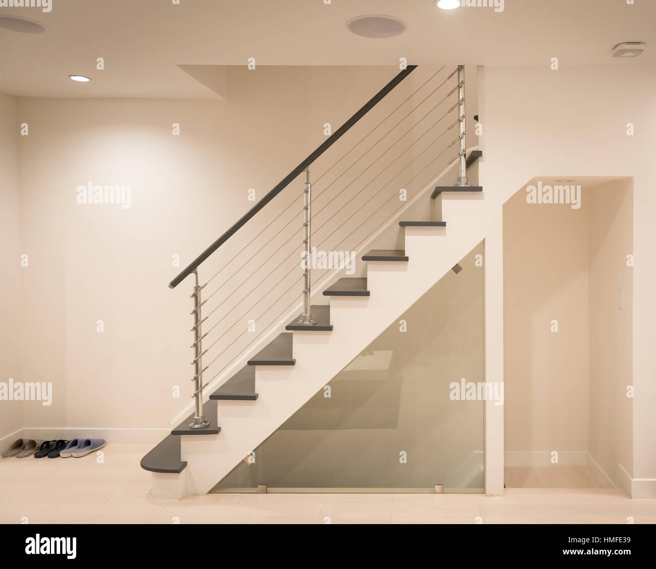 Modern staircase and hand rail design in white and grey color Stock Photo