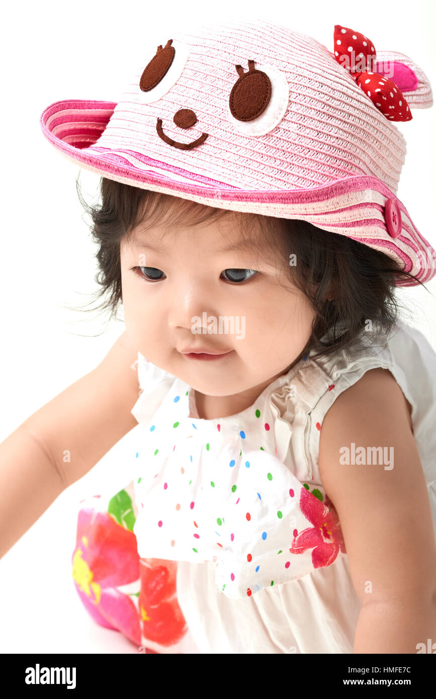 Asian baby girl wearing colorful cute hat Stock Photo