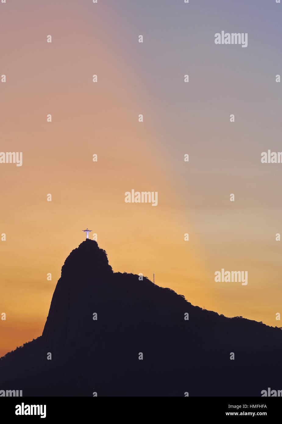 Sunset view of Christ the Redeemer statue and Corcovado Mountain, Rio de Janeiro, Brazil, South America Stock Photo