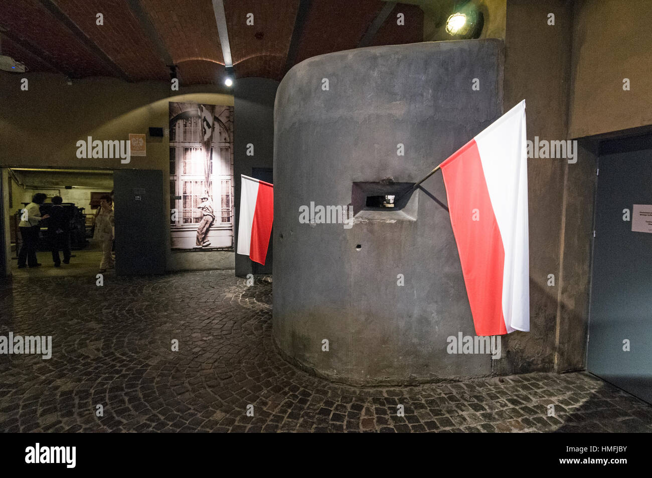 A machine gun pill box with a Polish flag at the Warsaw Uprising Museum
