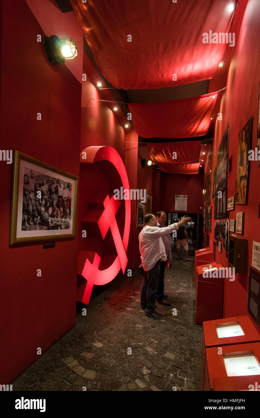 A display of photographs and the Russian hammer & sickle at the Warsaw Uprising Museum in Grzybowska, Warsaw,Poland Stock Photo