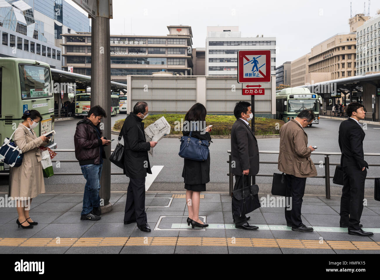 Commuters in a queue at Kyoto Station, Japan Stock Photo