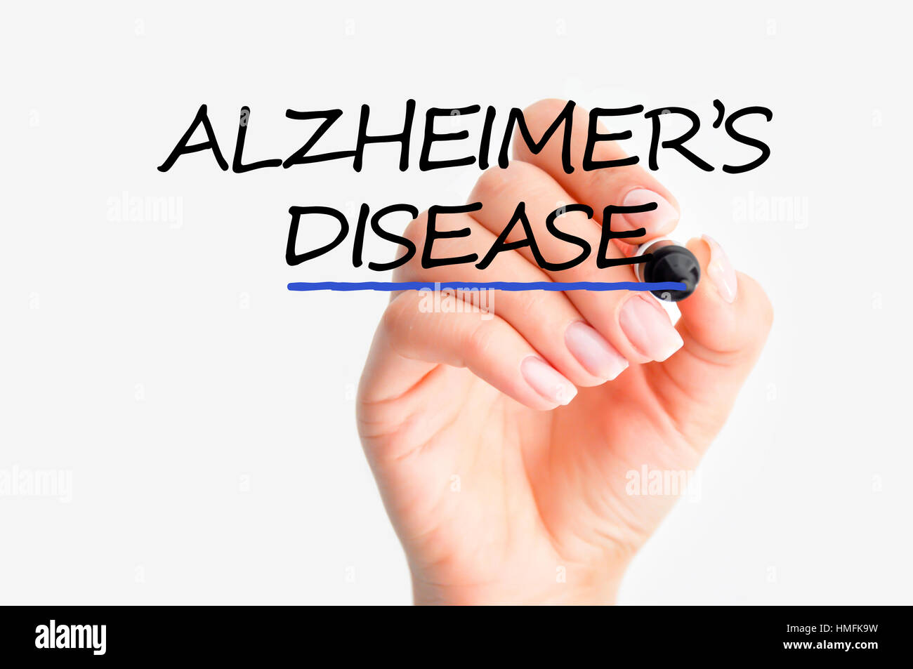 Woman hand writing Alzheimer’s disease on screen Stock Photo