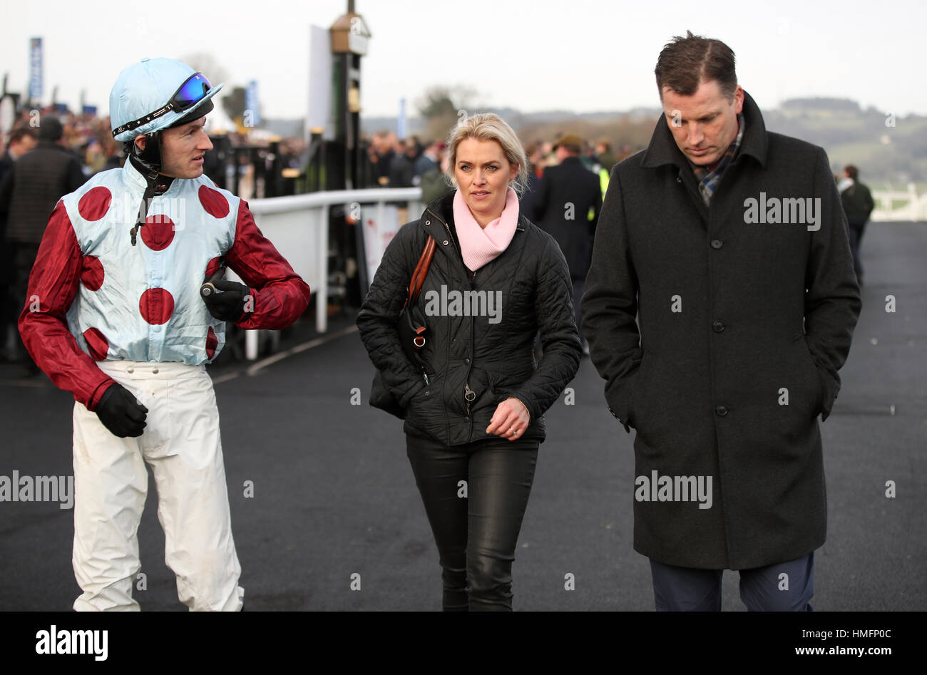 Jockey Adam Wedge with horse Racing agent Gearoid Costelloe (right) and partner of trainer Rebecca Curtis (centre) at Chepstow Racecourse. Stock Photo