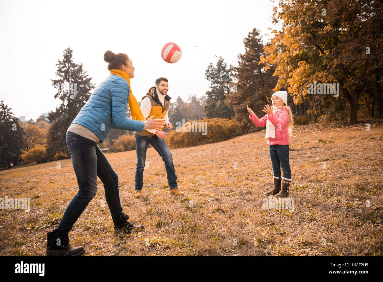 Happy family playing in park Stock Photo - Alamy