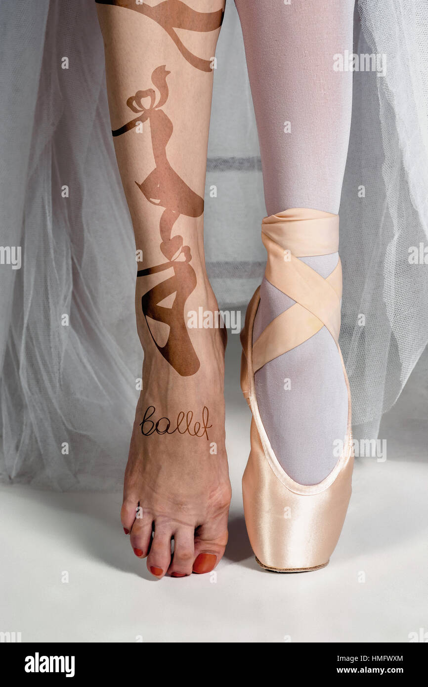 The close-up feet of young ballerina in pointe shoes Stock Photo